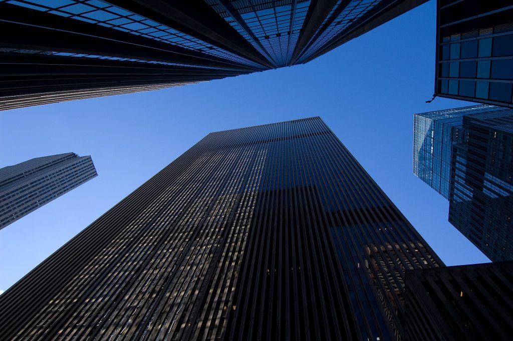 EY Breach Exposed Goldman Sachs Wealth Clients: Timeline and Lessons Modern glass office towers photographed from a low angle